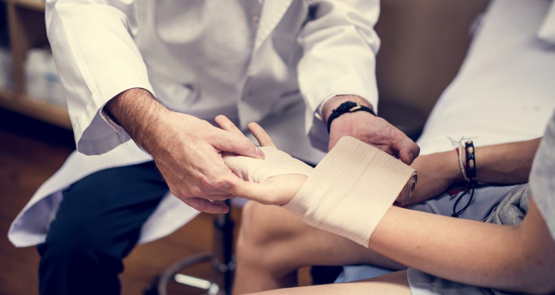 Doctor assisting a patient