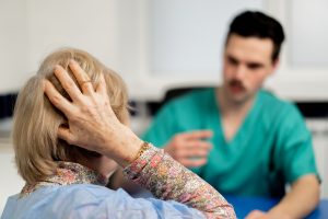 close up consultation between a doctor and an elderly patient in a plastic surgery clinic