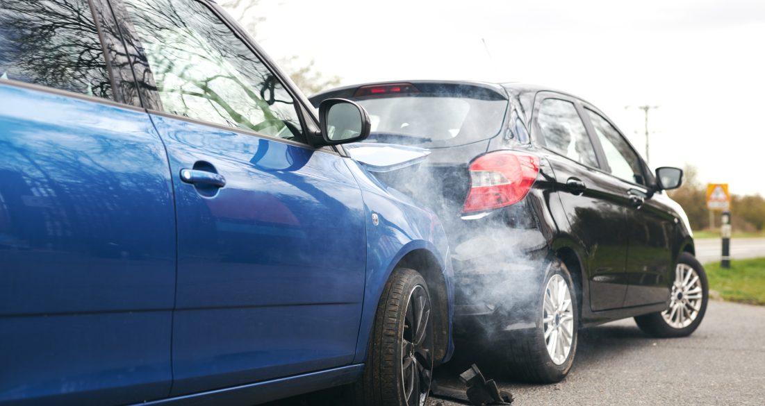 two damaged cars in a rear-end collision